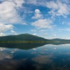 Reflection of Slivnica hill in Lake Cerknica