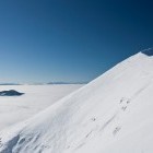 Skiing from the summit of Veliki vrh